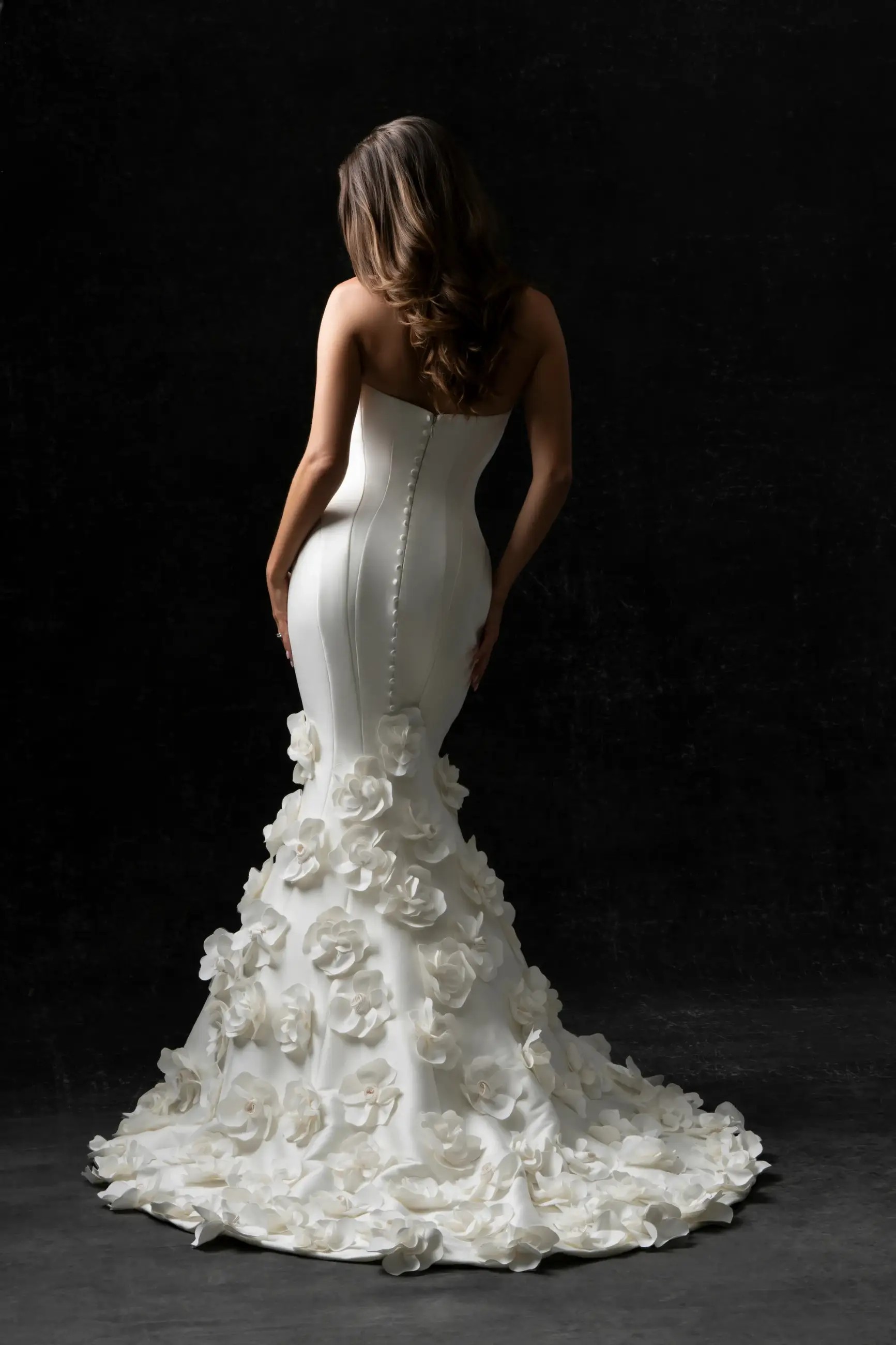 Model is wearing a strapless mikado bridal gown by allure bridals