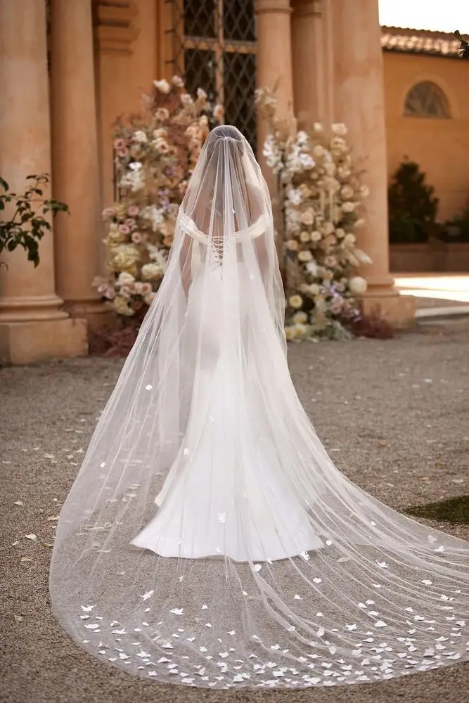 Model is wearing a mikado off the shoulder mermaid wedding gown by milla nova